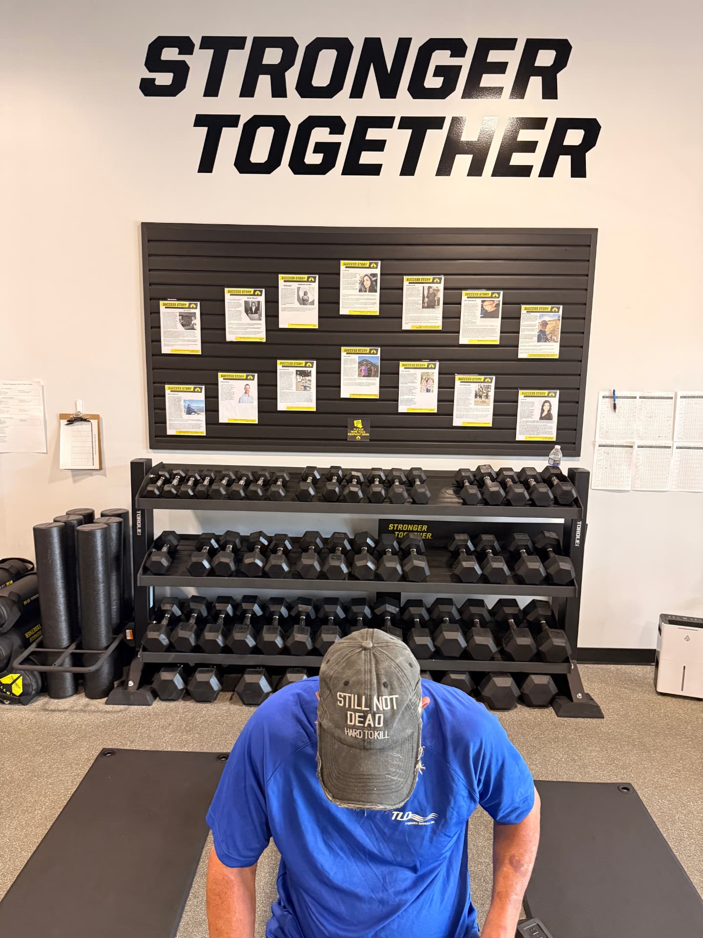 A Mt. Juliet member beneath the Stronger Together wall